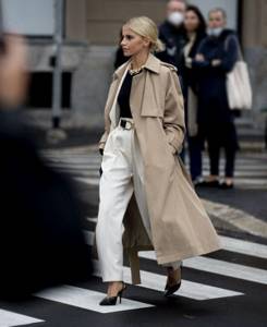 beige coat and white trousers