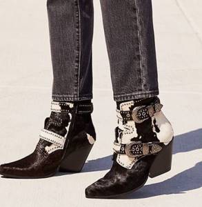 Black and white boots with buckles