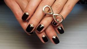 Black nails with gold holes