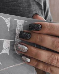 Black manicure with silver glitter