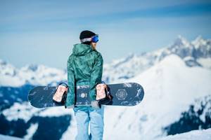 bachelorette party at a ski resort, girl with snowboard