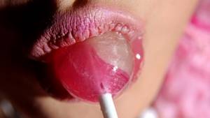 girl eating lollipop