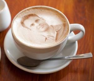 photo of a portrait on a cup of cappuccino