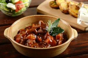 Beef stewed in red wine with mushrooms