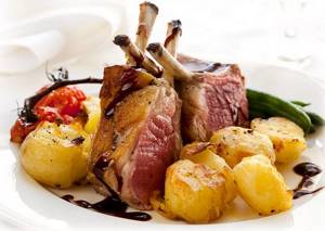 rack of lamb with potatoes in the oven in the sleeve