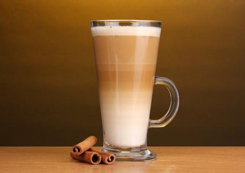 Coffee latte with cinnamon stick