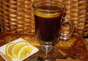 Coffee with lemon in a glass