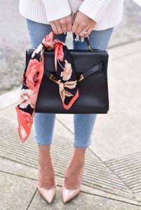 A beautiful floral print on black twilly will help you easily “fit” a strict black bag into a summer look