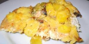 Piece of chicken with potatoes, pineapples and cheese