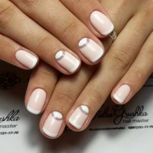 Lunar manicure with a transparent strip and double holes