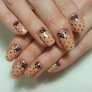 Lunar manicure with polka dots and bows