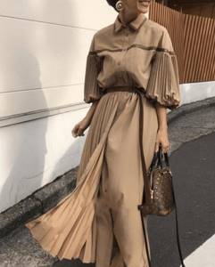 fashionable beige dress with lantern sleeves