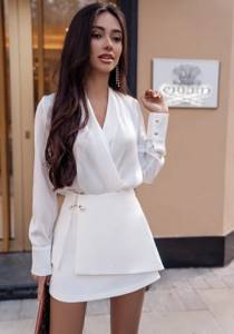 Fashionable youth look with a white blouse and white skirt