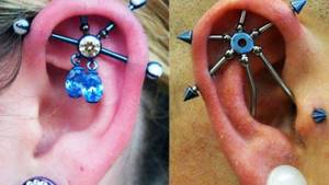 Pierced cartilage in a girl&#39;s ear with an earring, ring, stud, chain