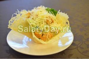 Salad with omelet in a cheese basket
