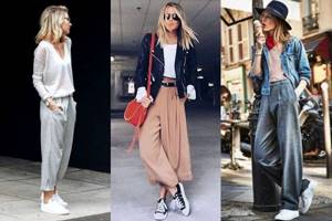 Combination of wide trousers with sports shoes