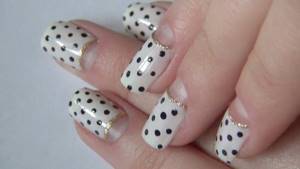 Stylish moon manicure with polka dots