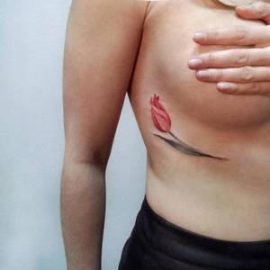 flower tattoo under breast
