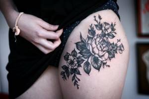 flowers tattoo on thigh