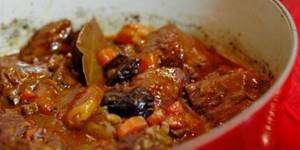 Beef stewed in a cauldron with prunes