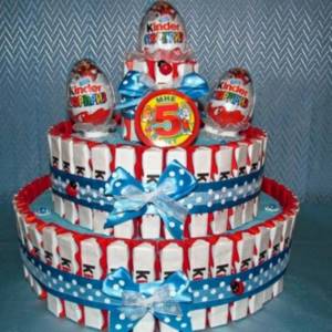 Three-tier cake made from chocolates and kinder eggs.