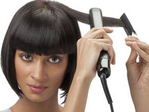 Straightening hair with an iron