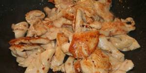 Fried chicken breast pieces in a slow cooker