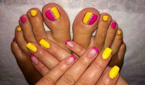 yellow and red pedicure